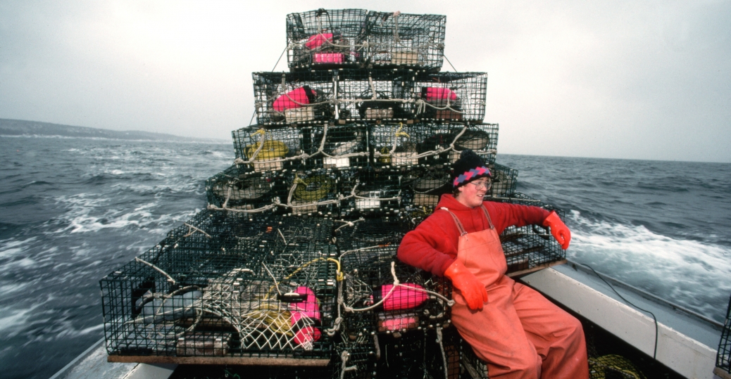 deckhandsittingwithlobstertraps Maine Pictures Maine