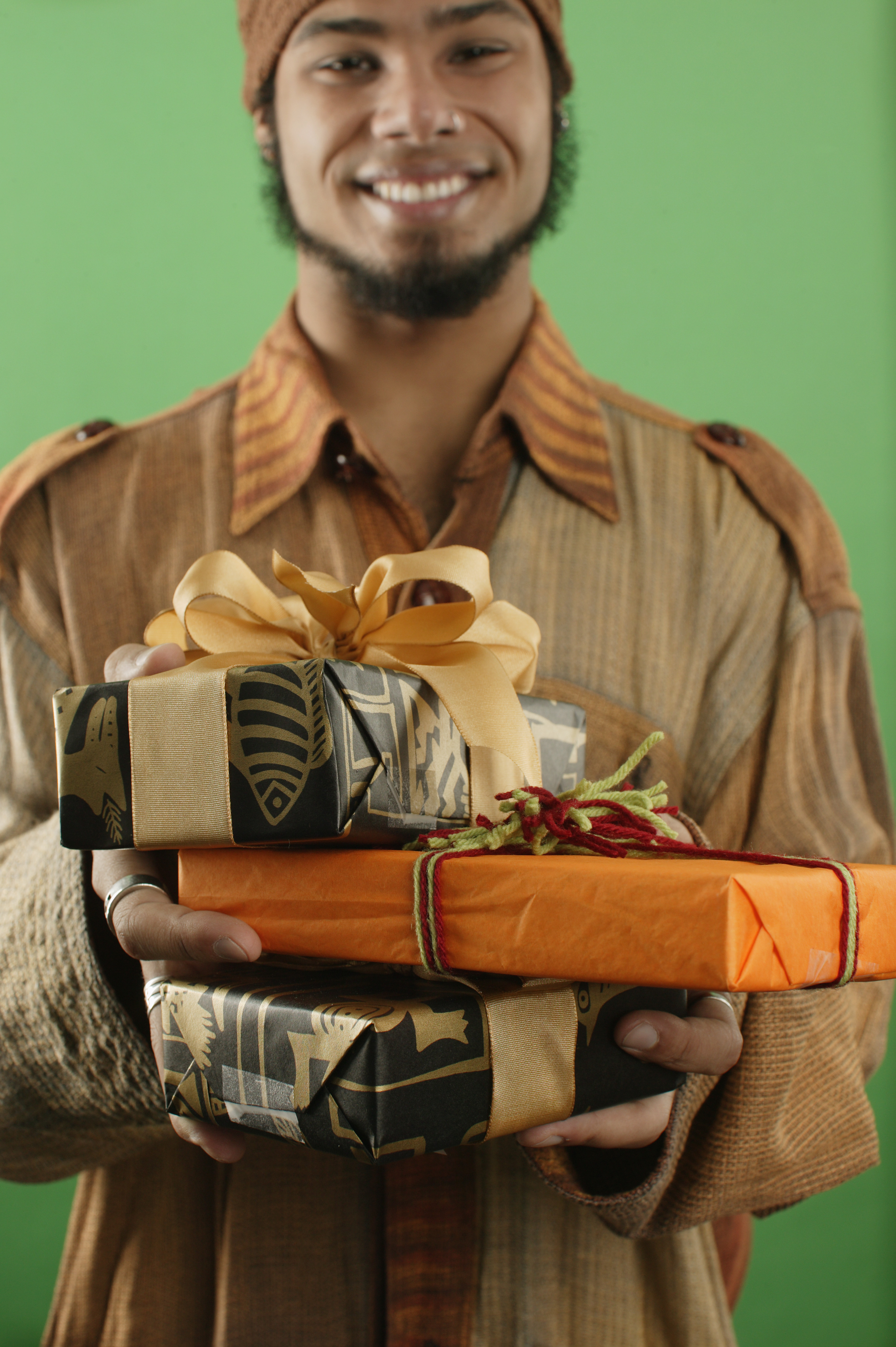 manwithwrappedgifts Kwanzaa Pictures Kwanzaa