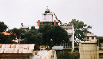 evacuees-boarding-a-helicopter - Vietnam War: The Fall of Saigon Pictures - Vietnam War - HISTORY.com