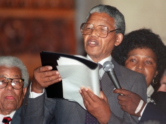 Mandela delivers his first speech following his release on February 11, 1990. (Credit: Walter Dhladhla/AFP/Getty Images)