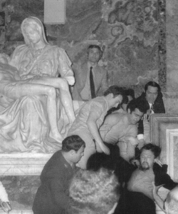 Laszlo Toth being removed from the Vatican after vandalizing the “Pieta”