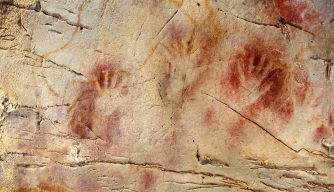 Handprints at the El Castillo cave in Spain, where paintings have been dated to as far back as 40,800 years ago. 