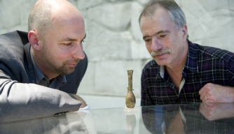 Michael Höveler-Müller and Helmut Wiedenfeld of the University of Bonn examine a flask thought to have belonged to the Egyptian queen Hatshepsut.