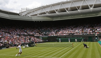 Defending champion Novak Djokovic plays against Juan Carlos Ferrero on the first day of the 2012 Wimbledon Championships