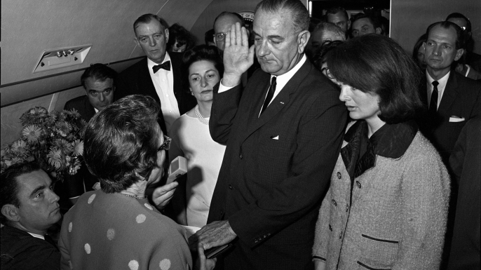 Judge Sarah T. Hughes administers the oath of office to Lyndon B. Johnson aboard Air Force One on November 22, 1963. (Credit: Universal History Archive/Getty Images