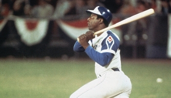 Hank Aaron hits home run 715, breaking Babe Ruth's record, on April 8, 1974.
