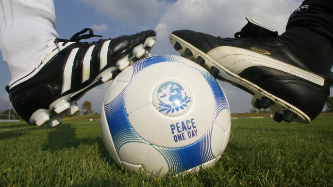 Employees of German sports equipment manufacturers Puma and Adidas prepare to kick-off the match between them in the city of Herzogenaurach. (Credit: Timm Schamberger/AFP/Getty Images)