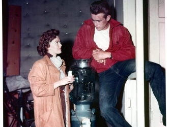 Natalie Wood talks with James Dean on set of the film 'Rebel Without A Cause' in 1955. (Credit: Warner Brothers/Getty Images)