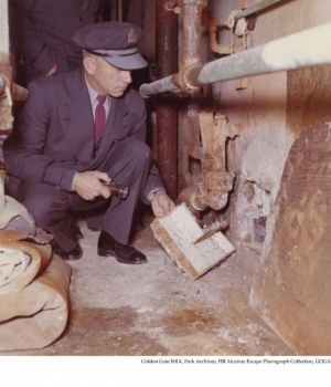 Alcatraz Correctional Officer investigating the 1962 escape in the utility corridor behind the cell #152.