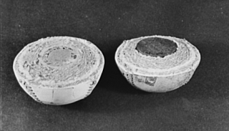 Halves of two baseballs. On the left, a traditional cork-centered ball, and on the right, a rubber-centered ball used during World War II. (Credit: Roger Smith)
