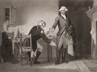 Engraving depicting American army officer Benedict Arnold seated at a table, as he hands papers to British officer John Andre during the American Revolutionary War. (Credit: Getty Images)