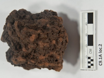 Sample being tested from Point Rosee. Scientists believe it is a lump of bog iron ore. (Credit Greg Mumford)