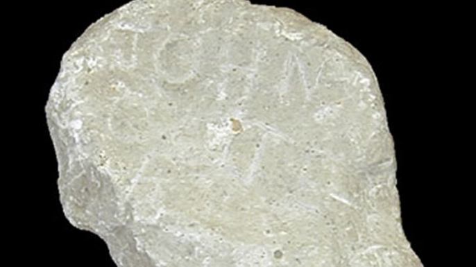 Stone with "John Colter" carved into it. (Credit: Public Domain)