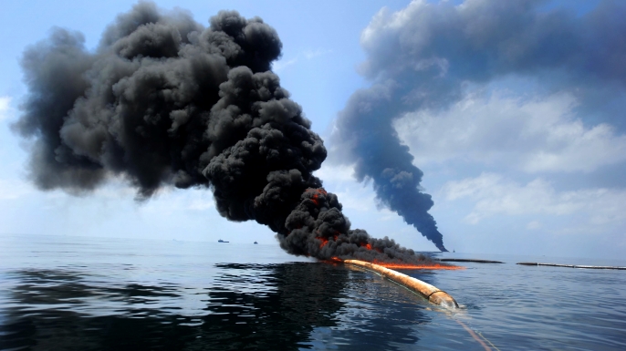 Dark clouds of smoke and fire emerge as oil burns during a controlled fire in the Gulf of Mexico. (Credit: Public Domain)