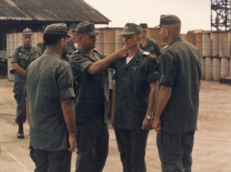 U.S. Army Maj. Charles Kettles in his second tour of duty in Vietnam, at a change of command ceremony where he took charge of the 121st Assault Helicopter Company, Soc Trang, Vietnam, 1969. (Credit: Retired U.S. Army Lt. Col. Charles Kettles)