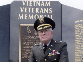Retired U.S. Army Lt. Col. Charles Kettles poses in front of the Vietnam Veteran’s Memorial in Ypsilanti Township, Michigan. (Credit: Retired U.S. Army Lt. Col. Charles Kettles)