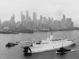Aerial view of Stockholm entering harbor after crash with Andrea Doria against skyline. (Credit: Howard Sochurek/The LIFE Picture Collection/Getty Images)
