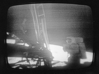 A shadow-shrouded Neil Armstrong, first man to walk on the moon, begins to deploy equipment a few minutes after taking the first momentous and historic step. (Credit: Bettmann/Getty Images)