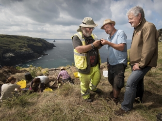 Tintagel Castle Archeology dig. L-R Ryan Smith (Trench Supervisor), James Gossip (Exec Director) and Win Scutt (Properties Curator West). (Credit: Emily Whitfield-Wicks for English Heritage)