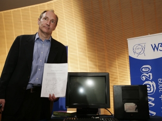 Tim Berners-Lee, Inventor of the Web, poses in front of the first World Wide Web Server. (Credit: SEBASTIAN DERUNGS/AFP/Getty Images)