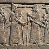King Shalmaneser III of Assyria meeting a Babylonian, detail from Shalmaneser III's throne, relief on stone.  (Credit: DeAgostini / Getty Images)