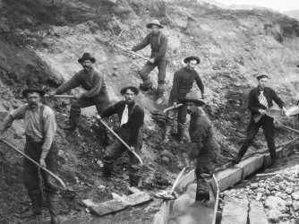 Miners panning and digging during the Klondike gold rush.