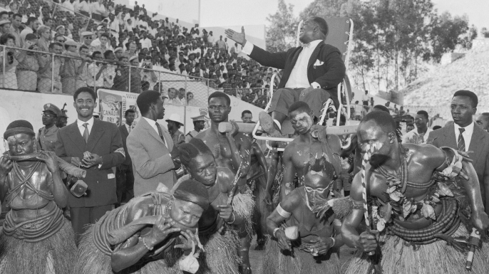 Armstrong is carried in triumph into Brazzaville's Beadouin Stadium during his African tour. (Credit: Bettmann)