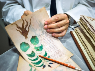 Luis Miguel, of the Spanish publishing company Siloe, Luis Miguel works on the replica of the Voynich Manuscript.