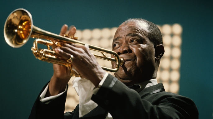 Louis Armstrong performing in June 1967. (Credit: David Redfern/Redferns)