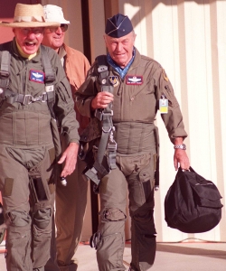 Hoover (left) walks with Chuck Yeager in October 1997, when Hoover once again flew the chase plane as Yeager recreated his sound barrier-breaking flight.