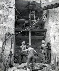 Workers in the early stages of constructing the Hall of Records. (Credit: Charles D'Emery photo, courtesy of NPS, Mount Rushmore National Memorial)