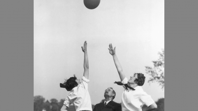Dr. James Naismith teaching two women how to play basketball. (Credit: George Rinhart/Getty Images)