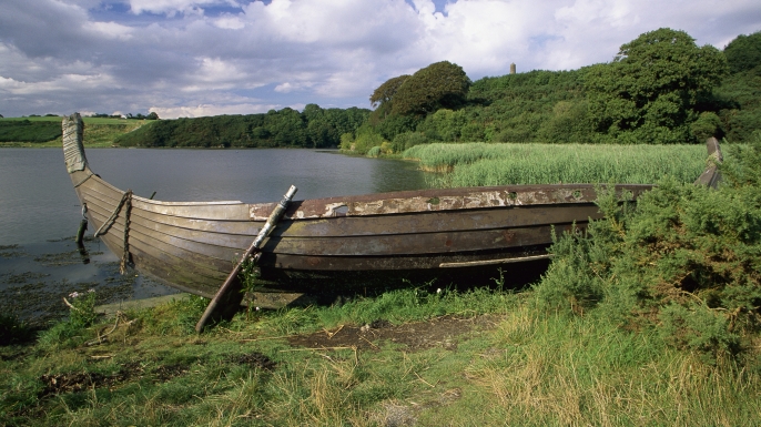 A Viking longship is beached on the lake shore at the Irish National Heritage Park. (Credit: Richard Cummins)