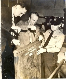 Archibald MacLeish sealing and securing the original signed and engrossed Declaration of Independence in preparation for its relocation attached. (Credit: Stephen Puleo/Library of Congress)
