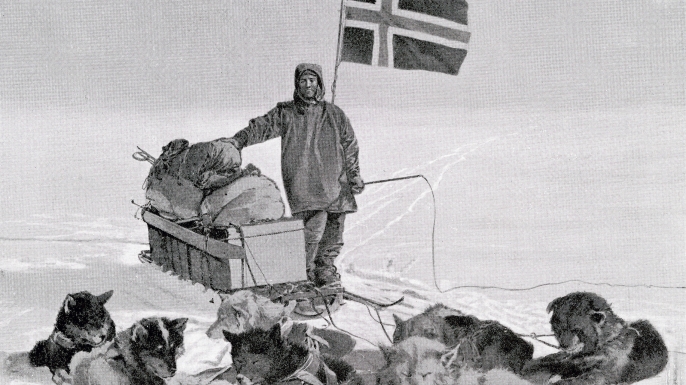 Captain Roald Engelbregt Gravning Amundsen at the South pole under the Norwegian flag. (Credit: Universal History Archive/Getty Images)