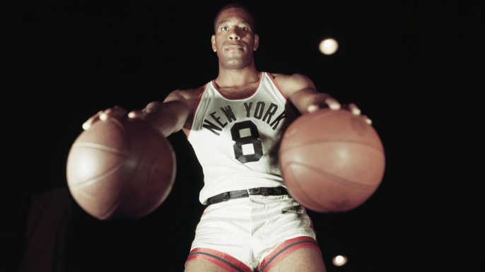 Nat Sweetwater Clifton, of the New York Knickerbockers, holding a basketball in each hand. (Credit: Bettmann / Contributor)
