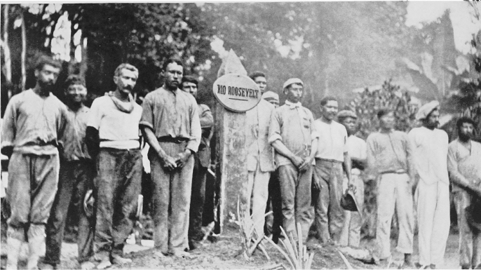The expedition standing next to a Rio Roosevelt marker.