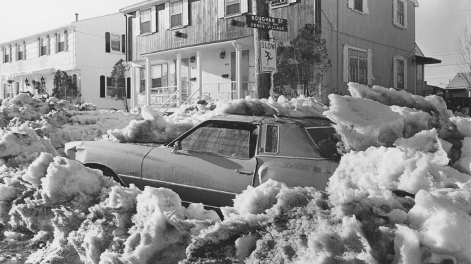 A car covered in snow on a street in Revere, Massachusetts, after a 27-inch snowfall during the Northeastern United States blizzard of 1978. (Credit: Barbara Alper/Getty Images)