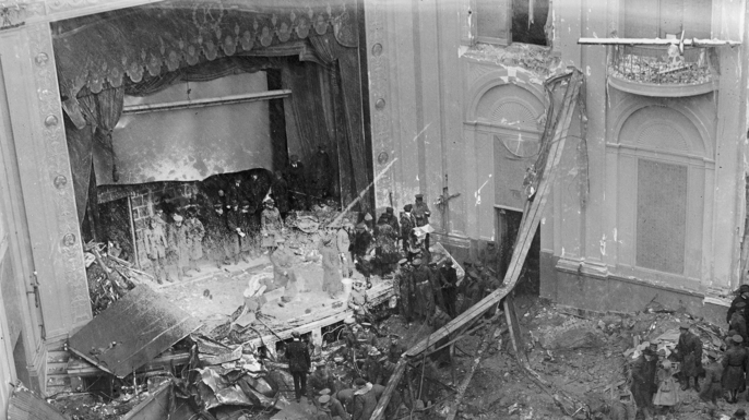 Policeman, rescue workers, and onlookers stand amid the wreckage of the Knickerbocker Theatre, Washington DC, January 29, 1922, during the Knickerbocker Storm. (Credit: Herbert A. French/Buyenlarge/Getty Images)