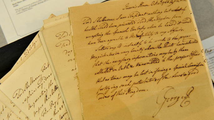 An autographed letter by British King George III regarding peace negotiations with America after the War of Independence. (Credit: STAN HONDA/AFP/Getty Images)