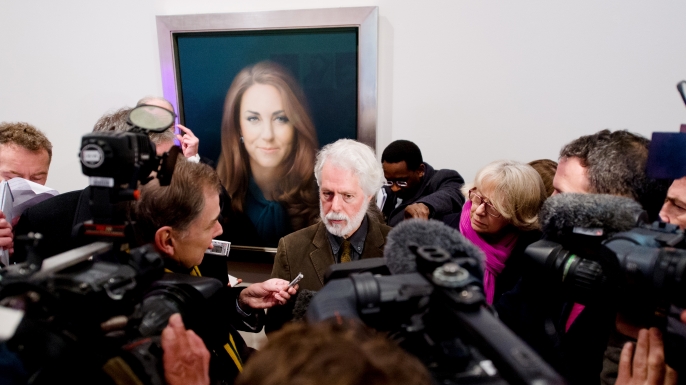 British artist Paul Emsley poses in front of his portrait of Catherine, The Duchess of Cambridge. (Credit: LEON NEAL/AFP/Getty Images)