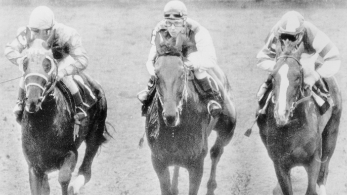 Diane Crump (center), the first woman to compete in a regular event in U.S. thoroughbred racing history. (Credit: Bettmann/Getty Images)