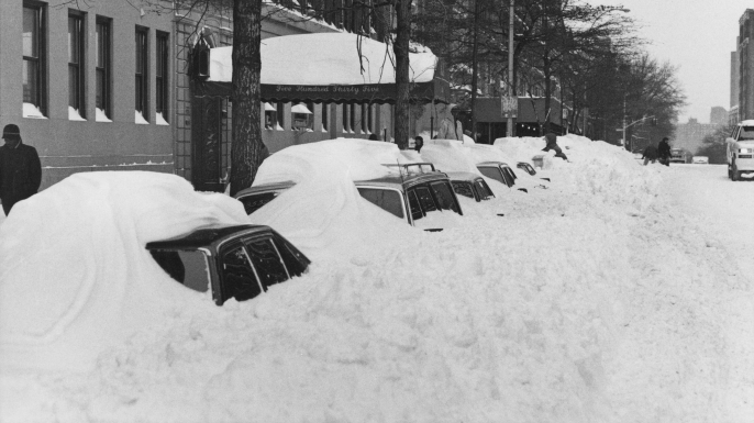 Snowdrifts covering parked cars on 110th Street after more than 20 inches of snow fell in two days in New York City in 1996. (Credit: Barbara Alper/Getty Images)