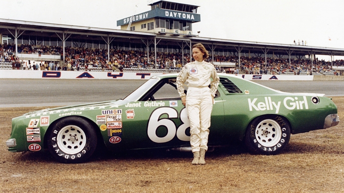 Janet Guthrie #68 stands in front of her car before the 1977 Winston Cup Daytona 500 on February 20, 1977. (Credit: ISC Archives/Getty Images)