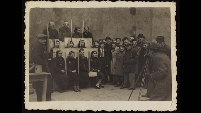 Henryk photographing for identification cards, Jewish Administration Statistics Department c. 1941. (Credit: Art Gallery of Ontario)