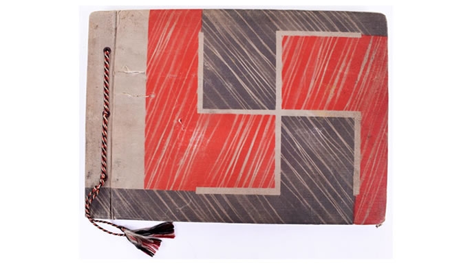 The photo album cover, with engraved swastika. (Credit: C&T Auctions)