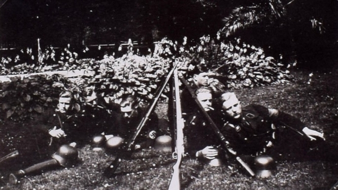 Candid shot of German soldiers relaxing on the grounds. (Credit: C&T Auctions)