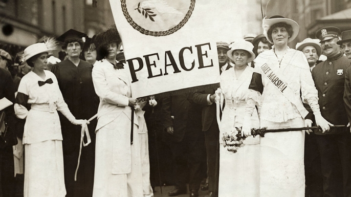 Women carrying peace banner during an international protest against war. (Credit: Bettmann/Getty Images)