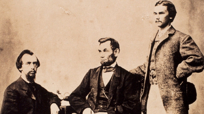 A studio portrait of Abraham Lincoln with his two personal secretaries, John Nicolay (left) and John Hay (right). (