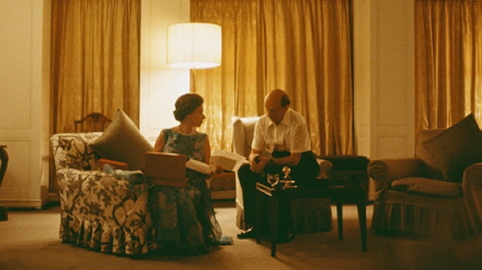 Queen Elizabeth II and Sir Martin Charteris reviewing papers on board Britannia, 1972.